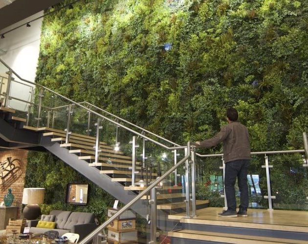 Artificial living wall by restaurant staircase