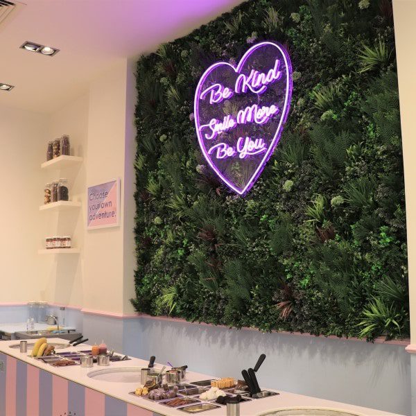 pan-n-ice-neon sign on an artificial living wall