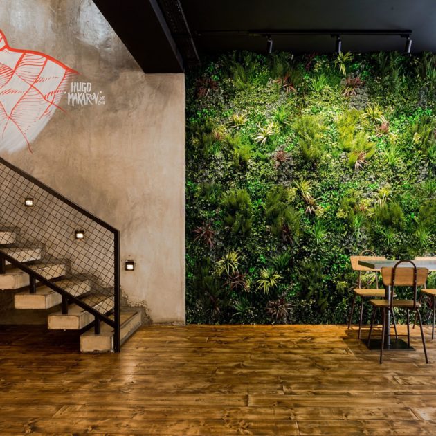 Realistic Artificial living wall by table and chairs