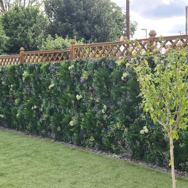 A Vistafolia artificial green wall installation on a garden fence