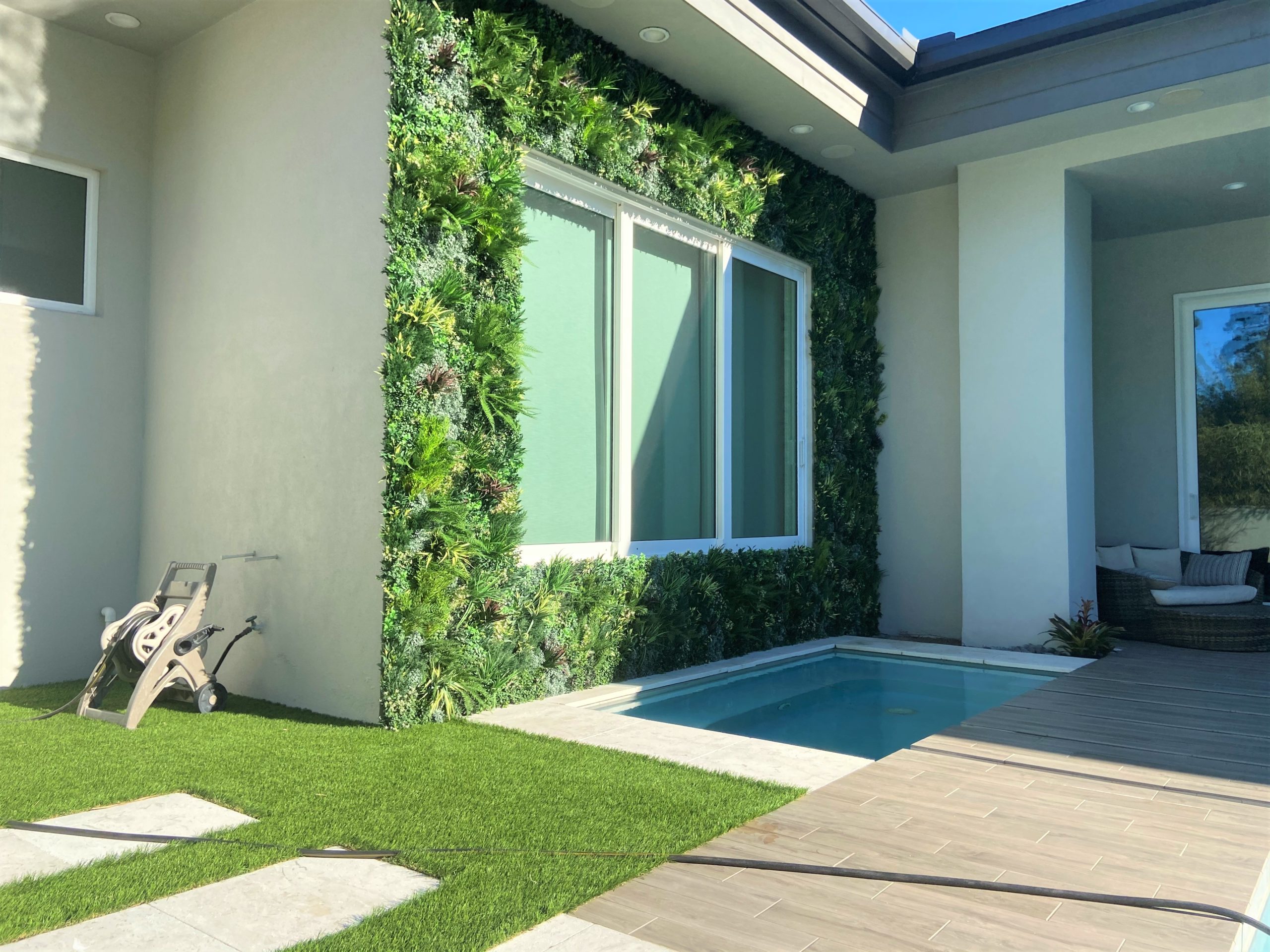An Artificial Green Wall Installation in a backyard in Orlando Florida