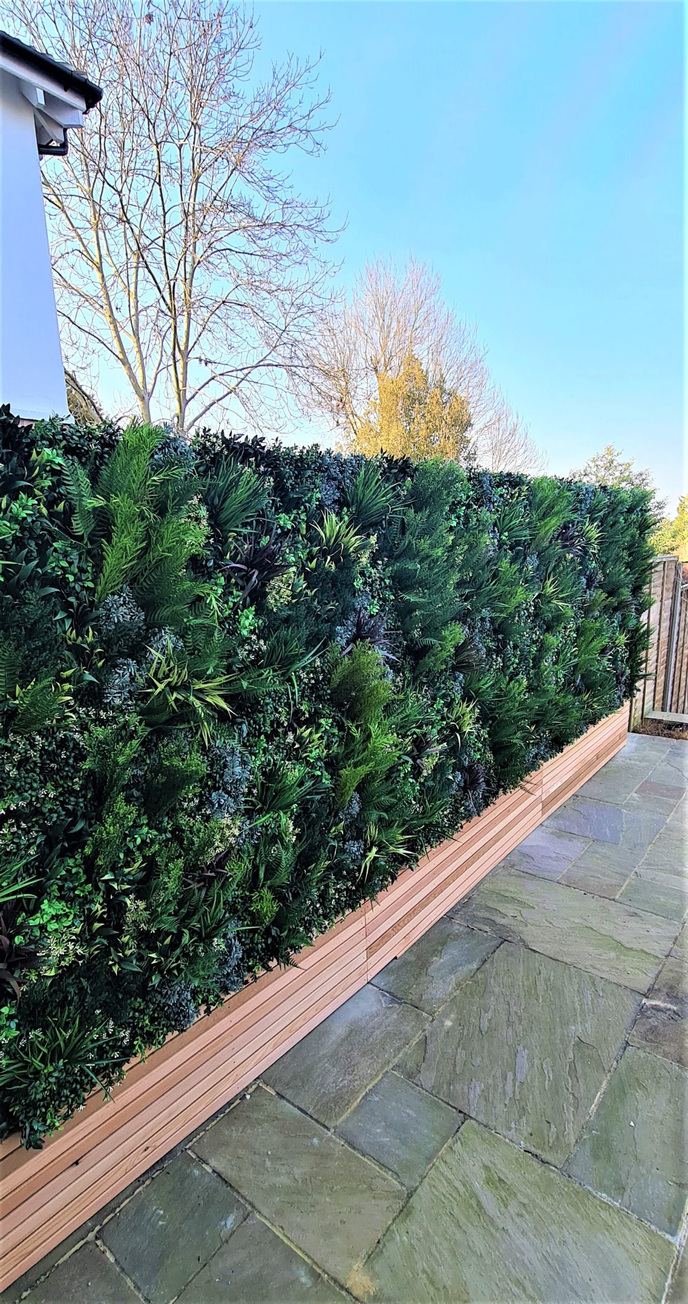 a replica green wall installation on a fence
