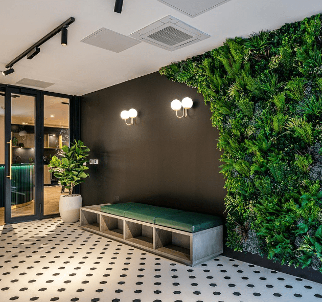 Artificial green wall in an apartment lobby in London