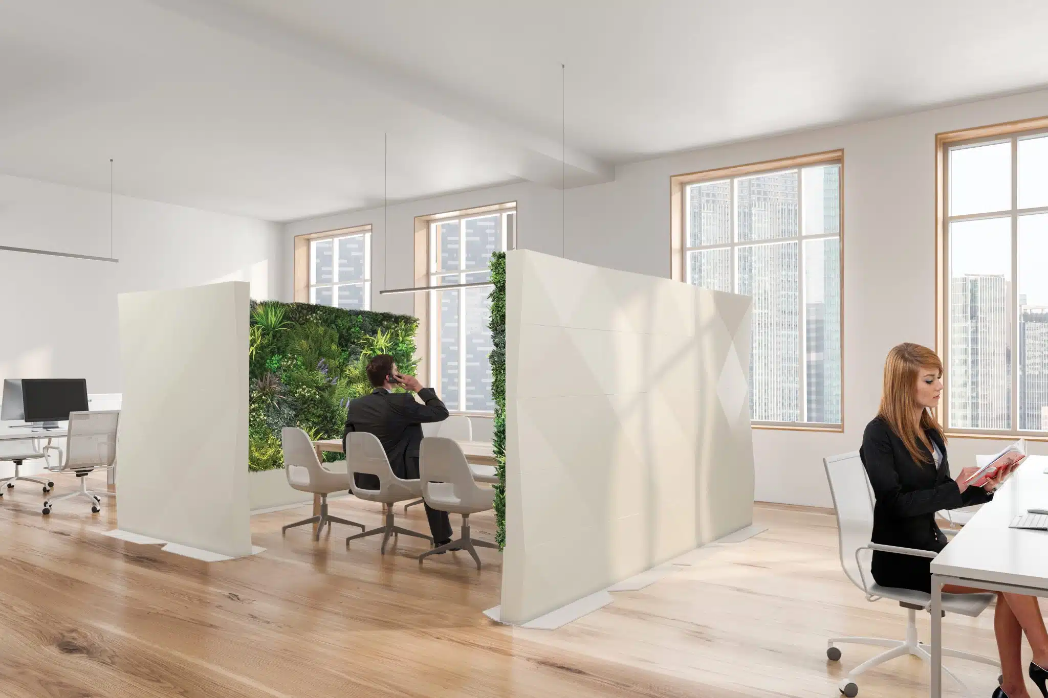 A modern office with wooden floors showcases an open seating area divided by Modular Green Wall Partitions and white panels. One person reads at a desk, while another is in a meeting area. Expansive windows reveal stunning cityscape views.