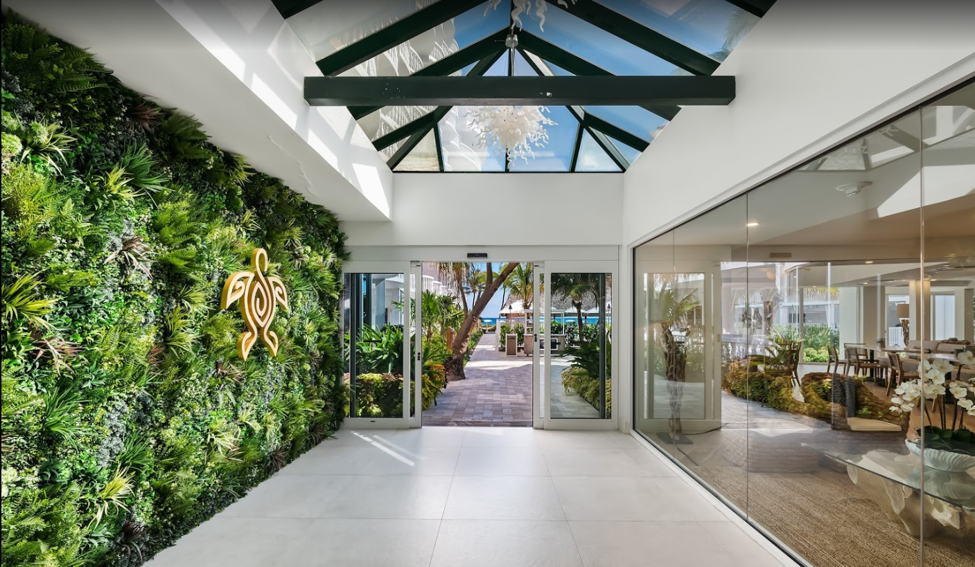 a faux green wall in a hotel lobby area in Florida