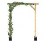 A wooden pergola archway with a simple design includes extendable artificial trailing foliage and climbing green ivy on one side. It stands on two black rectangular bases, with the ivy adding a natural, decorative touch.