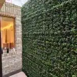 A green wall installation using Vistafolia Luxury Flowering Panels
