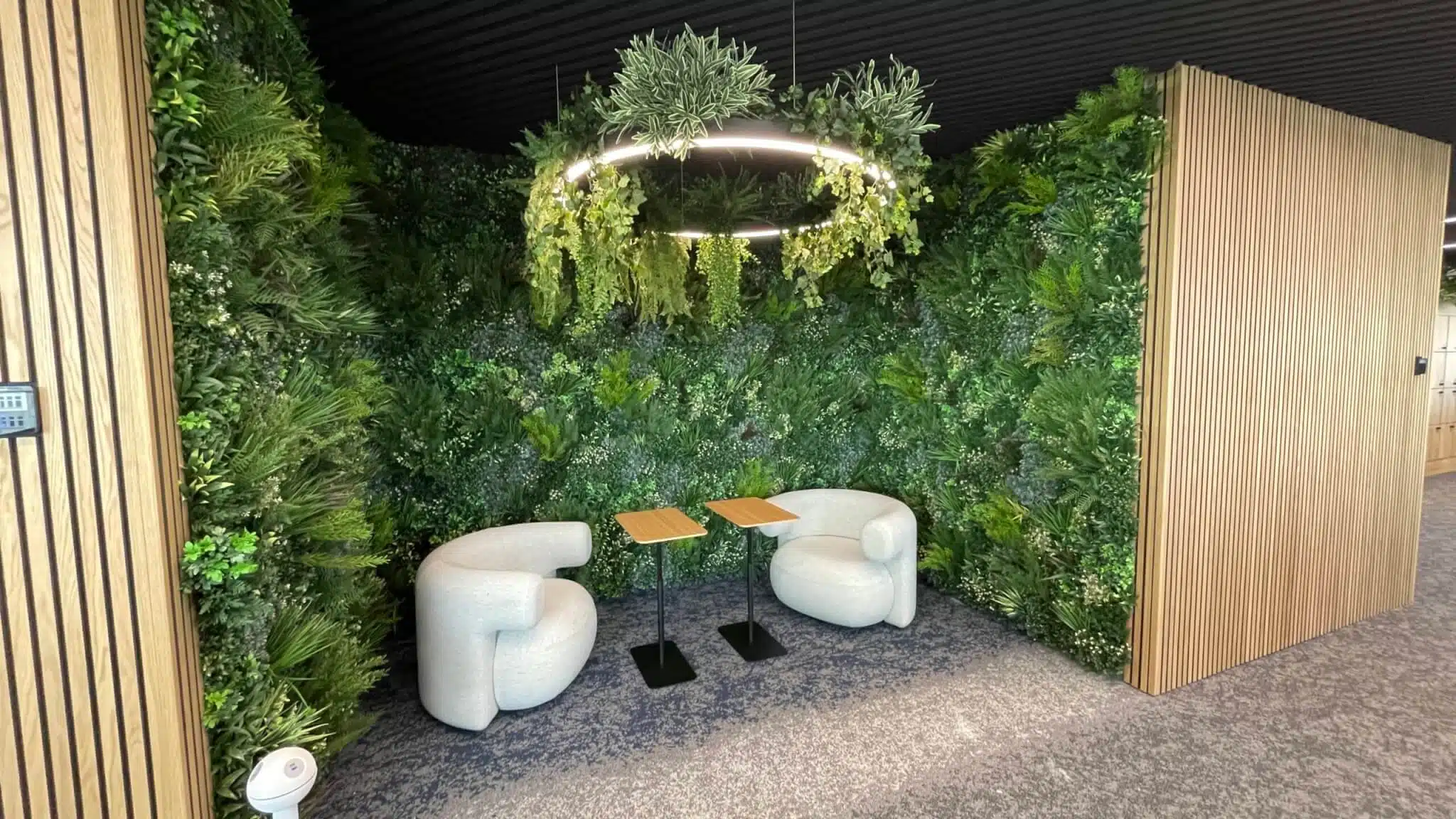 Artificial Green Wall surrounding seating area