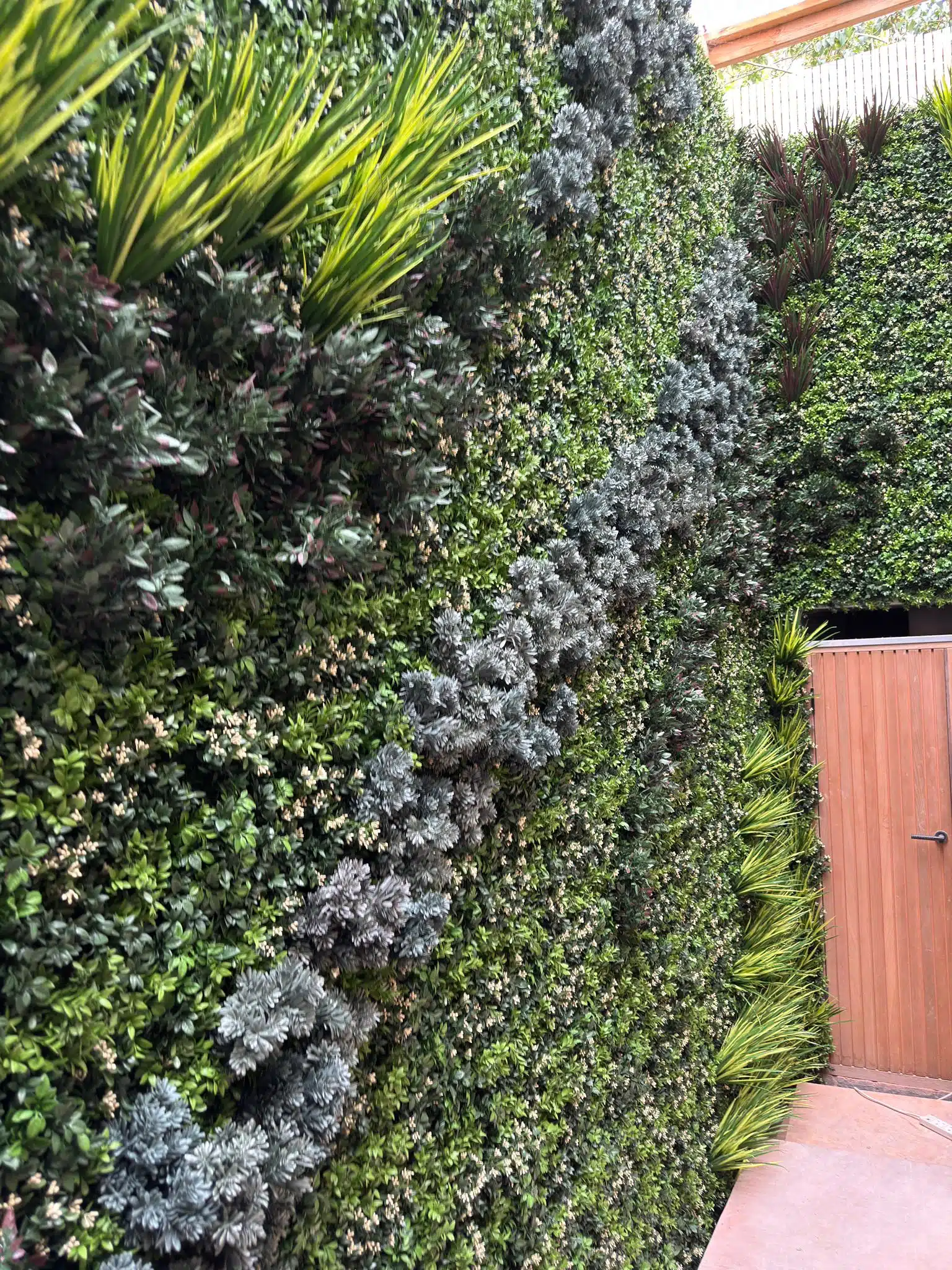 a close up of an fake plant wall that looks like an artificial moss wall