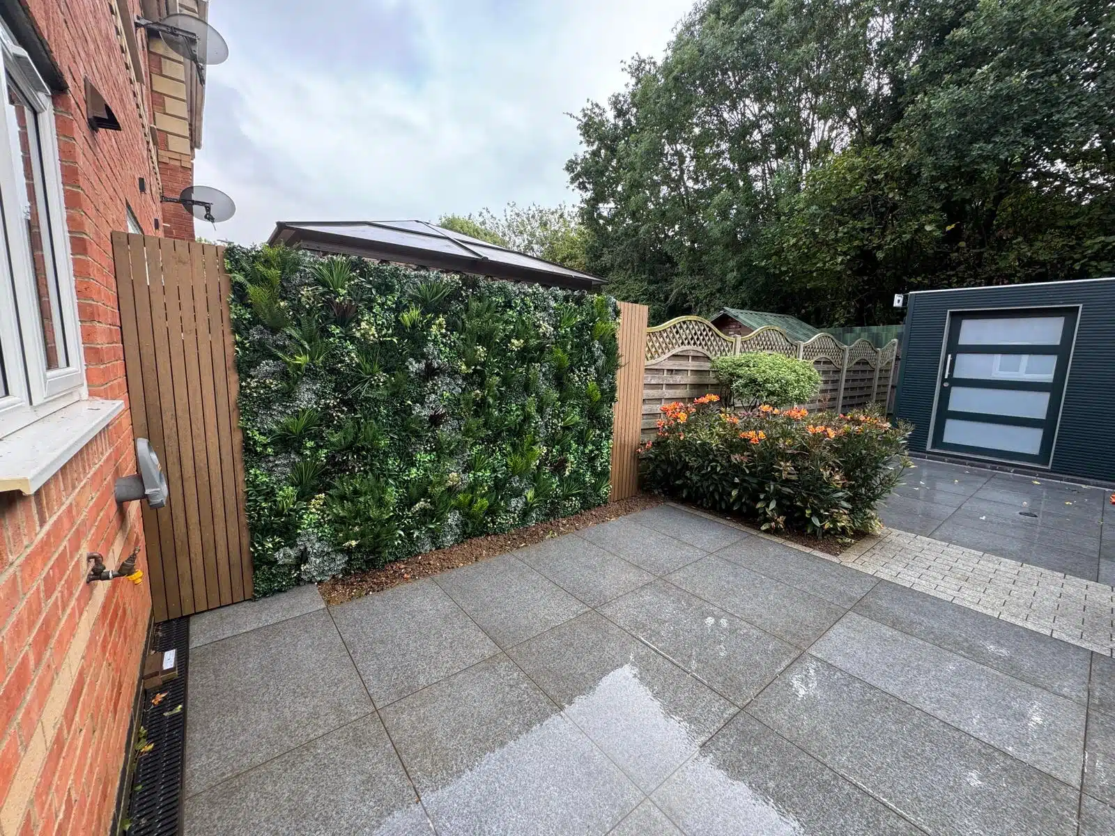 artificial plant walls installed on a fence in a garden